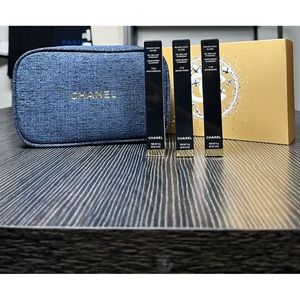 Chanel Brand 3 piece lipgloss with cosmetics bag beautiful navy blue with gold.